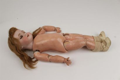BEBE JUMEAU
Poupée à tête en porcelaine à...