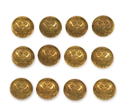 LOT DE 12 BOUTONS en laiton doré ornés de...