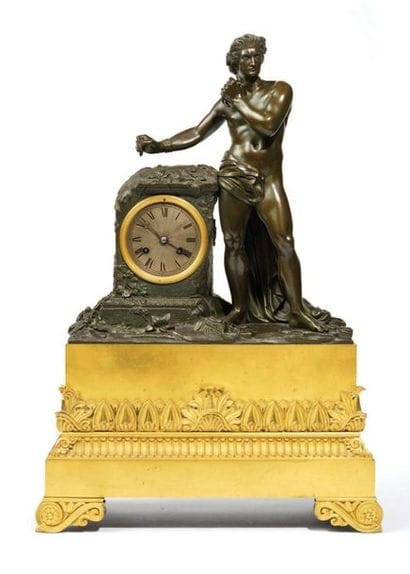 PENDULE en bronze patiné et bronze doré,...