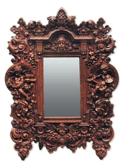 Miroir en tilleul sculpté de forme rectangulaire...