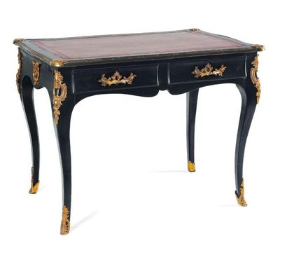 Petit bureau en bois noirci ouvrant sur deux...