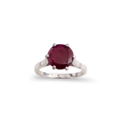 Platinum ring set with a round ruby weighing...