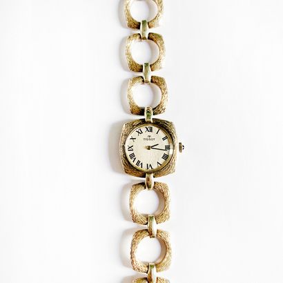 TISSOT. Ladies' watch in textured silver...