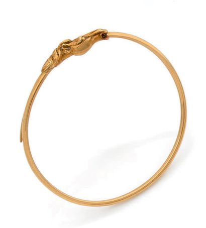 Bracelet jonc en or jaune 18K (750) terminé...