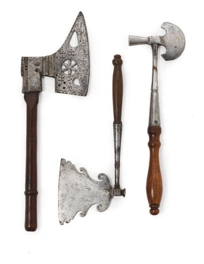 SET OF THREE METAL AND WOODEN AXES The largest...
