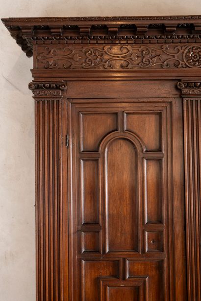Moulded and carved walnut double cabinet...
