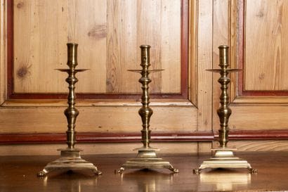 Set of three polished brass torches with...