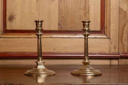 Pair of polished brass candlesticks with...