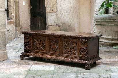 Large carved and molded walnut chest. The...
