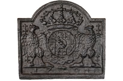 Cast iron curved fireback with eagles.

Early...