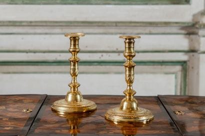 Pair of ormolu candlesticks 
The baluster-shaped...