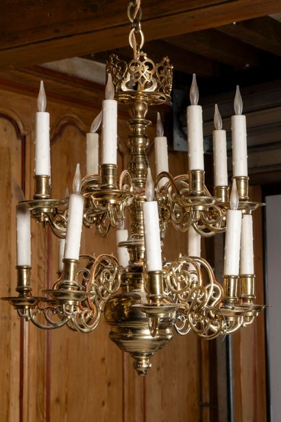 Polished brass chandelier with twelve lights...