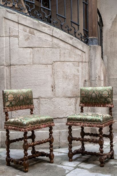 Pair of low-back walnut chairs turned with...