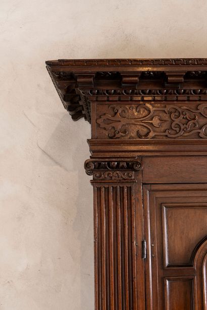 Moulded and carved walnut double cabinet...