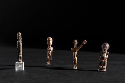 Set of four wooden statuettes, one in the...