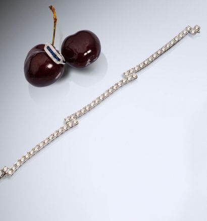 A hinged, tiered bracelet in 750 white gold,...