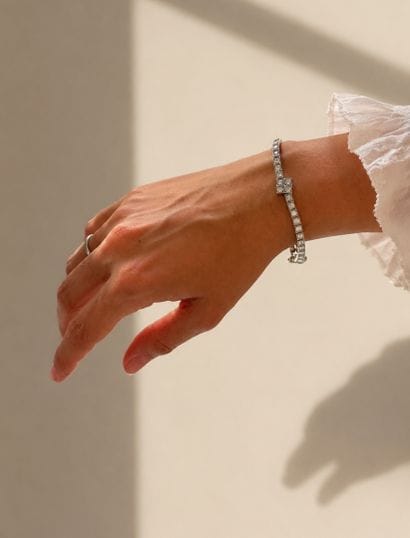 A hinged, tiered bracelet in 750 white gold,...