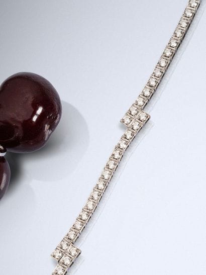 A hinged, tiered bracelet in 750 white gold,...