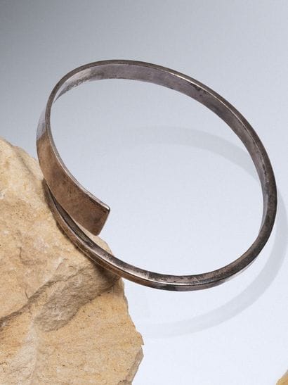 925 sterling silver clasp-style bangle.
Signed...