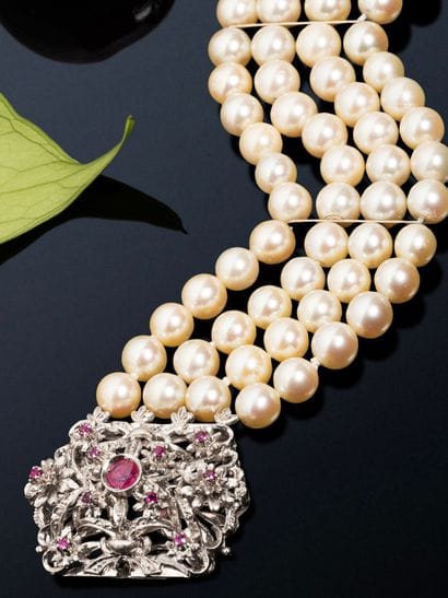 A striking bracelet with four rows of pearls,...