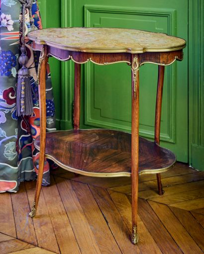 Natural wood side table with curved top featuring...
