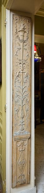 Carved and painted wood paneling decorated...