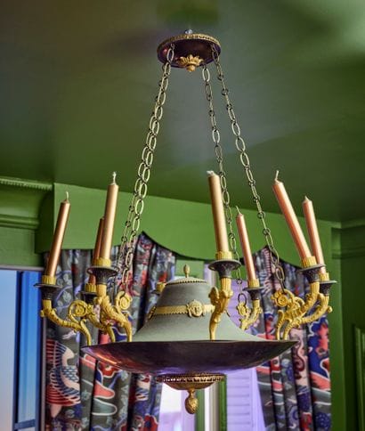 Eight-light ormolu and patinated chandelier....