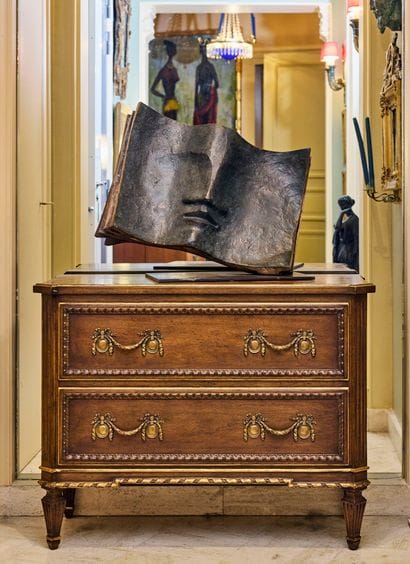 Natural wood chest of drawers opening with...