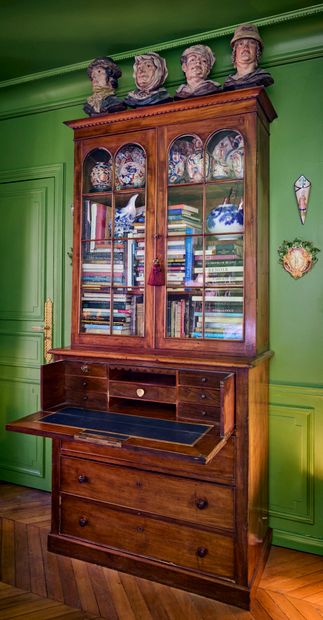 Natural wood chest of drawers opening with...