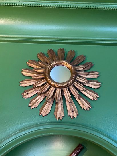 Double-spoke sunburst mirror in molded, carved...