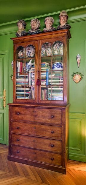 Natural wood chest of drawers opening with...