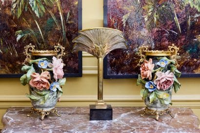 Pair of polychrome barbotine vases with flowers...