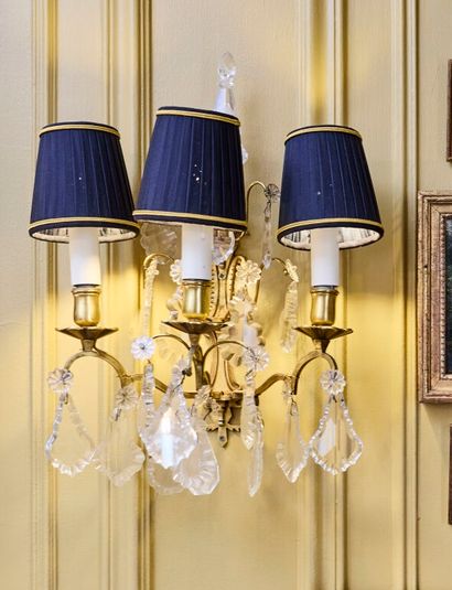 Pair of three-light gilt metal sconces adorned...