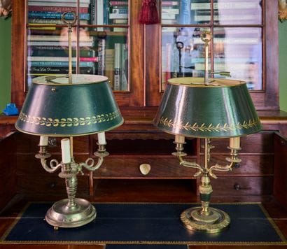 Reunion of two bouillotte lamps with sheet...