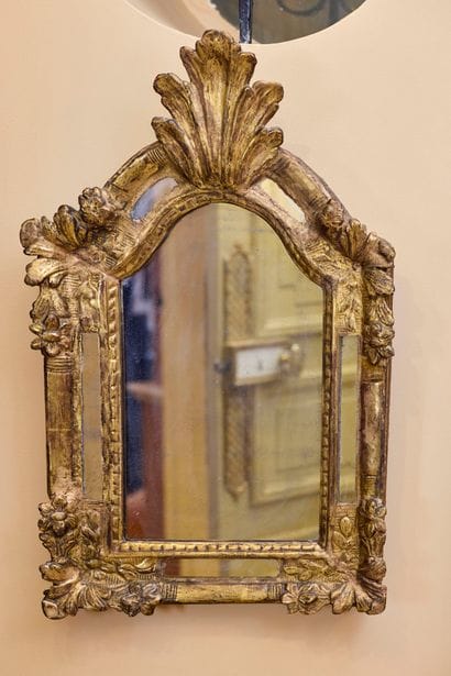 Carved and gilded wood mirror with acanthus...