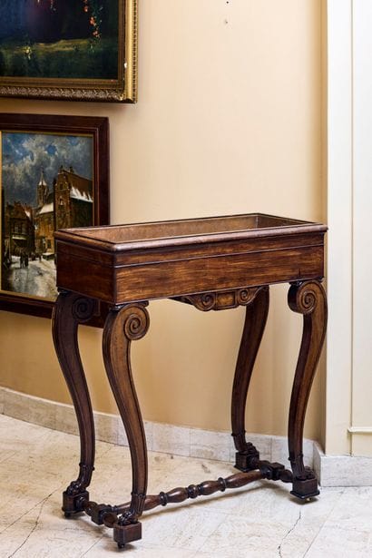 Natural wood planter, scrolled base joined...