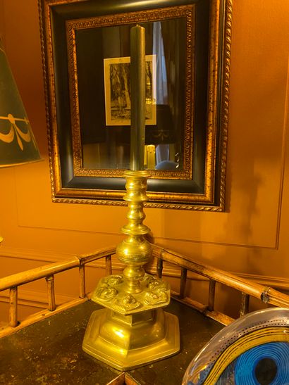 Brass candlestick with putti decoration,...