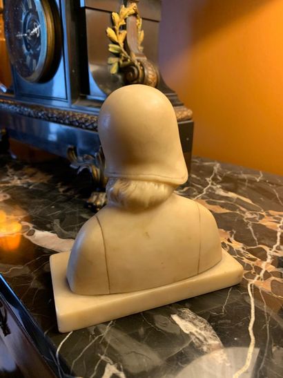 Female bust looking to the right in white...