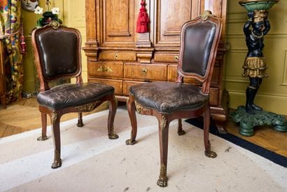 Pair of molded and carved natural wood chairs,...
