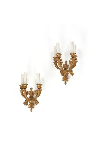 Pair of chiseled and gilded bronze wall sconces...