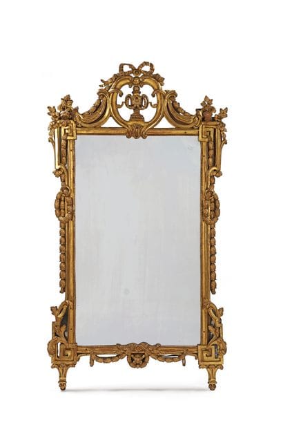 Large molded, carved, and gilded wooden mirror...