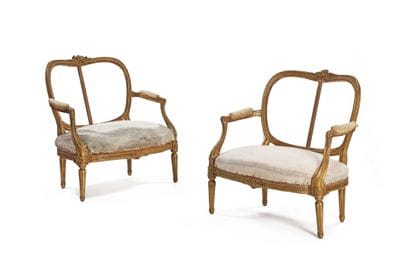 Pair of carved and gilded wooden armchairs,...