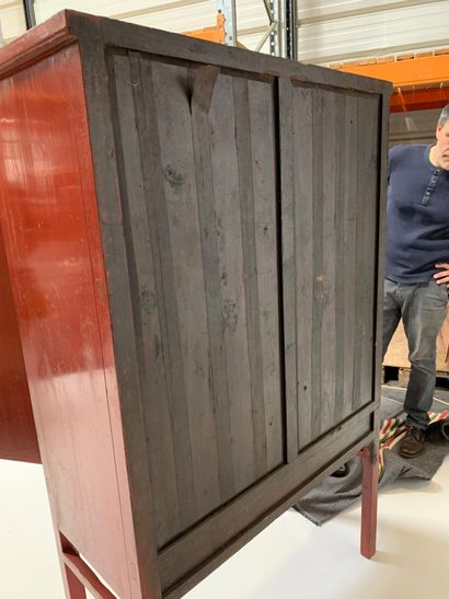 Red lacquered wooden cabinet with two doors...