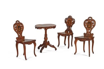A table and three chairs made of wood veneer...