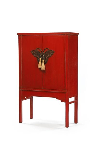 Red lacquered wooden cabinet with two doors...