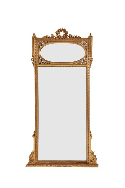 Carved and gilded wooden trumeau decorated...