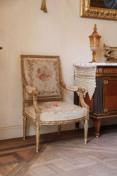 A carved and gilded wooden living room set...