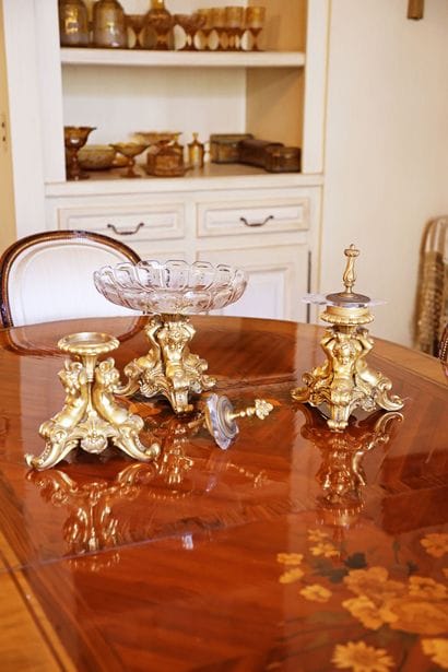 A table set consisting of three gilded bronze...