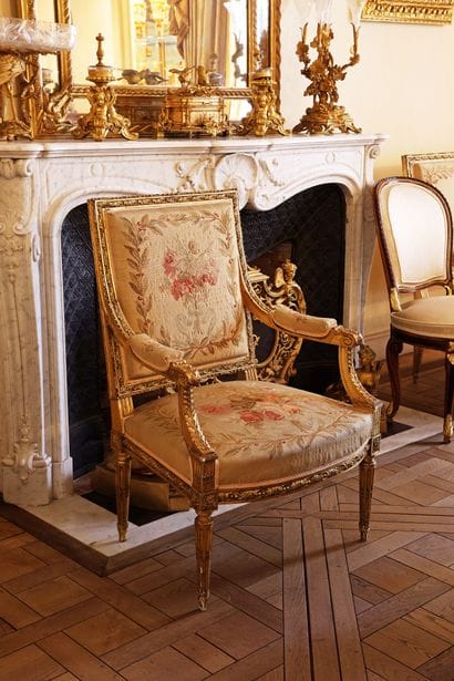 A carved and gilded wooden living room set...