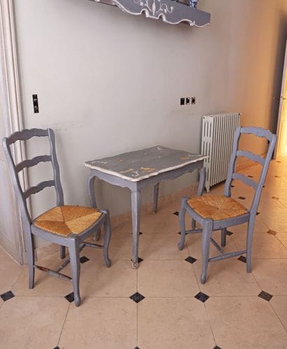 Blue-lacquered wooden table with scalloped...